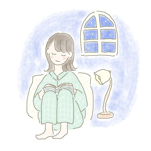 夜　リラックスして読書中の女性イラスト